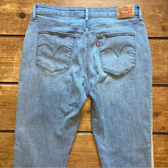 Levi’s Classic Mid Rise Skinny Jeans Size 32 Metallic Sides Light Wash - Picture 3 of 8